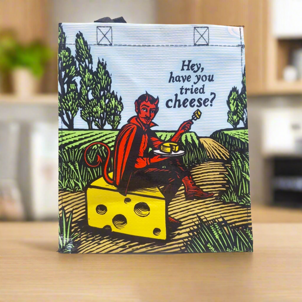 This is our cheesy devil lunch bag, which has a picture of the devil, sitting on a wedge of cheese with cheese on the plate, saying Hey have you tried cheese?
