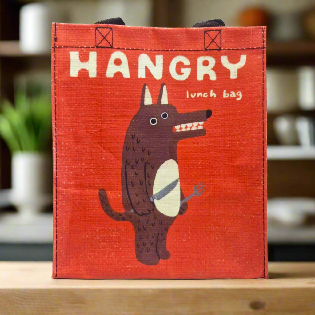 This is our Hangry Lunch Bag which is a quirky red Lunch Bag with a wolf holding a knife and fork on it with the word Hangry at the top.