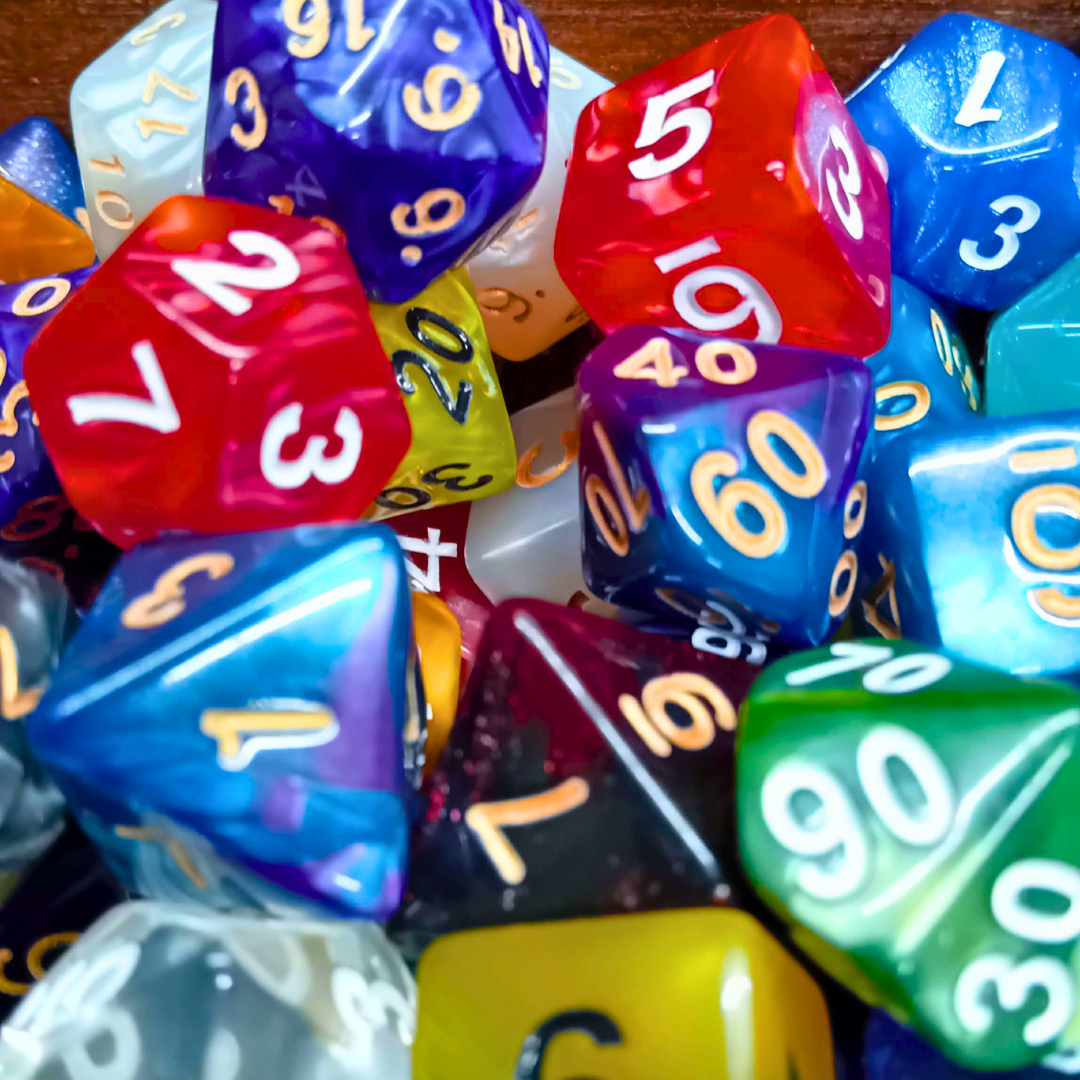 Colorful polyhedral dice with various numbers on a wooden surface