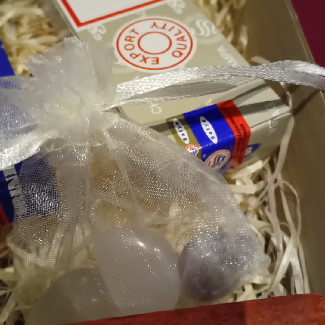 Product packaging with a decorative bow on a textured surface