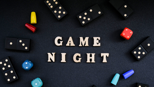 An image that says Game Night on it surrounded by Dice and Dominoes