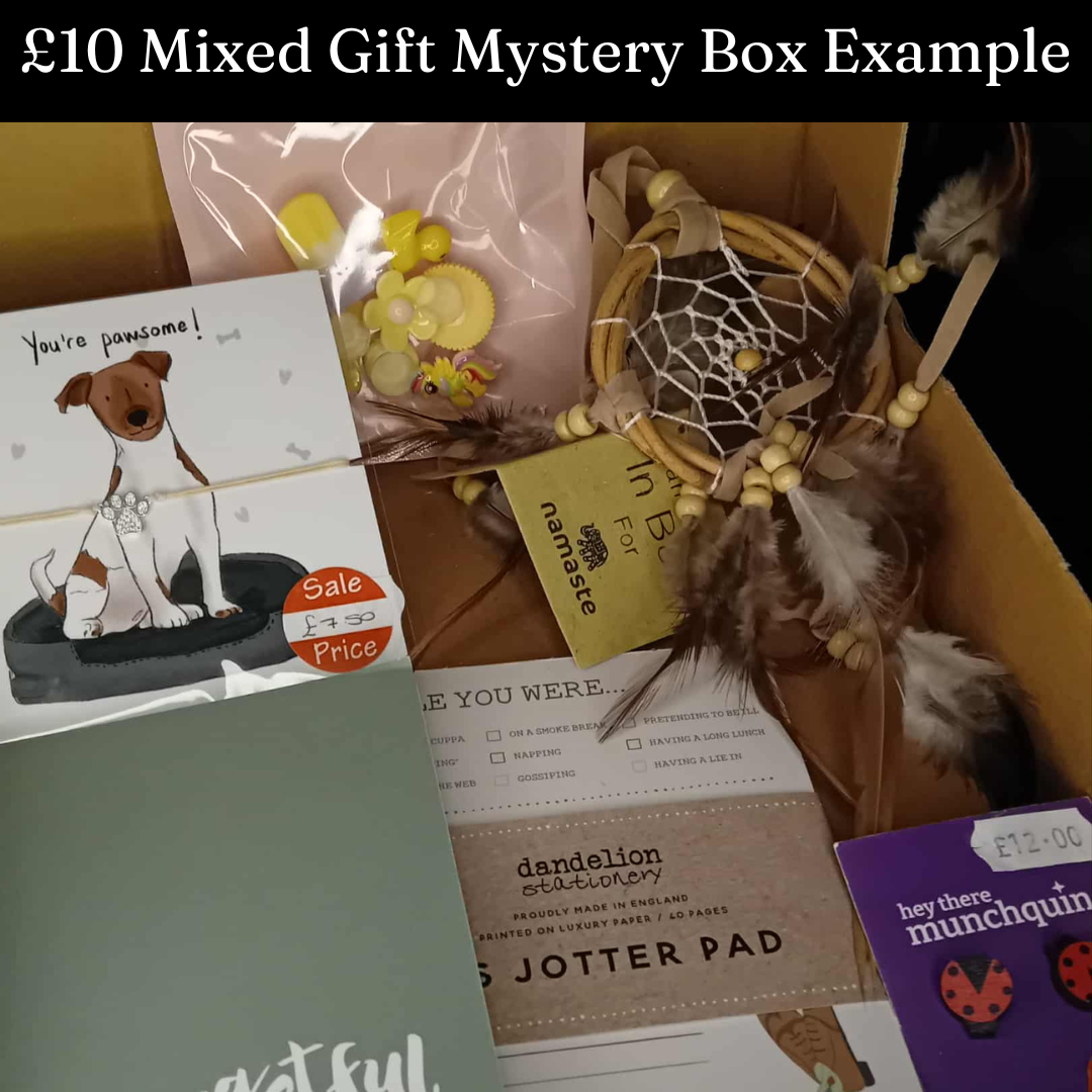 Mixed gift mystery box with various items including a card, dreamcatcher, and stationery items.