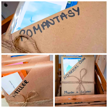 Collage of books wrapped in brown paper with text labels on a wooden surface.