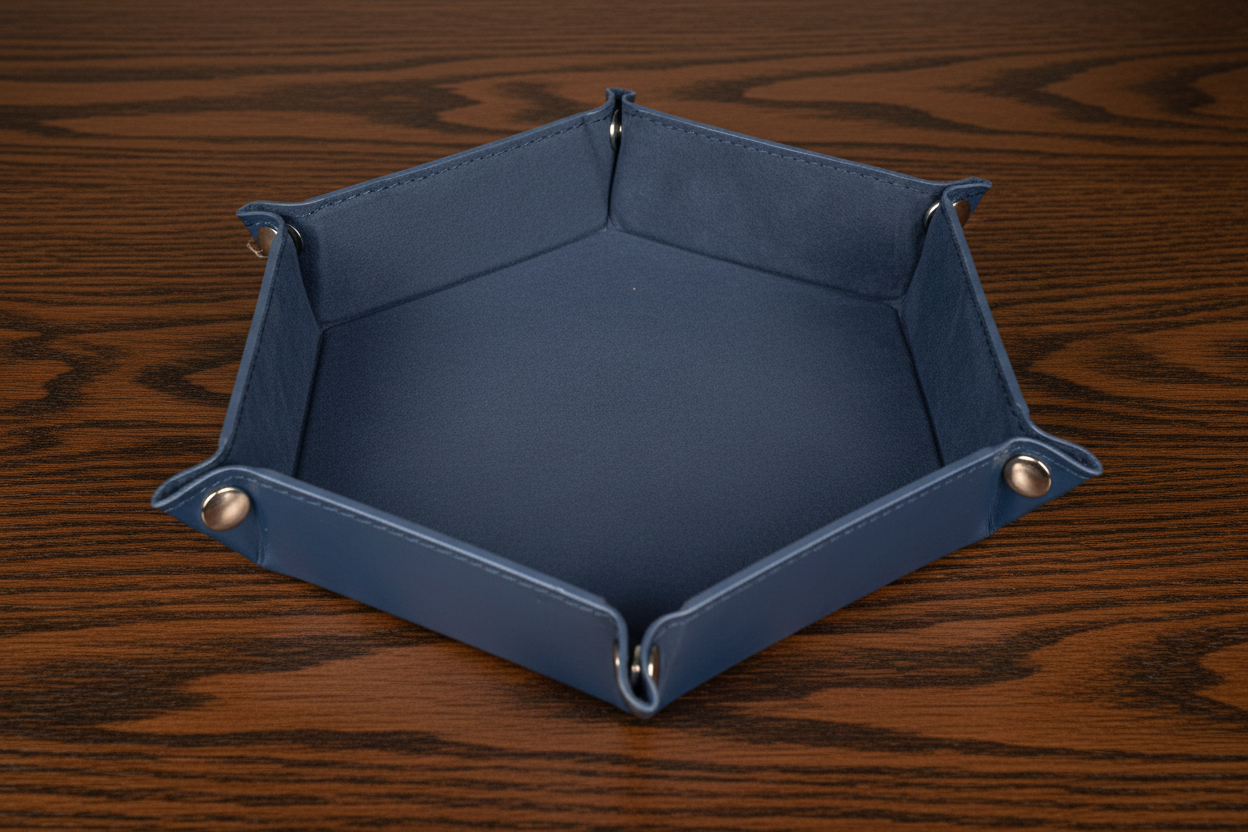 Blue leather and velvet dice tray on a dark oak table