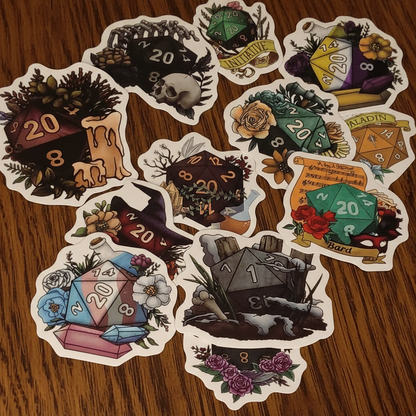 Collection of stylised dungeons and dragons D20 dice and fantasy-themed stickers on a dark oak table