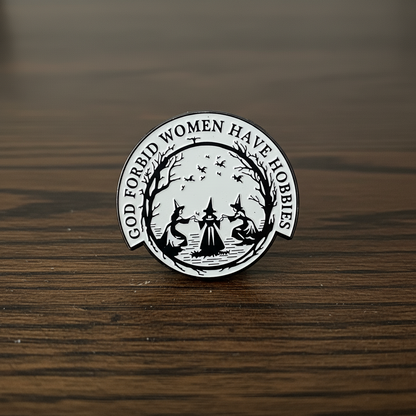 Circular design with text 'God forbid women have hobbies' on a yellow background