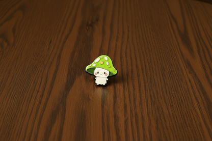 Green Mushroom-shaped pin with a white face on a dark oak table