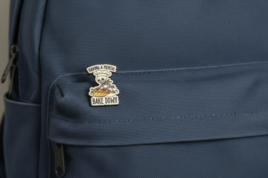 Pin Badge with a skull chef design on saying having a mental back down on a backpack