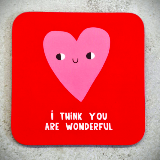 A red coaster with a smiling pink love heart on it. Text under the love heart saying I think you are wonderful