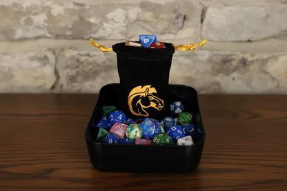 Black dice bag with a horse logo filled with colorful dice on a dark surface.