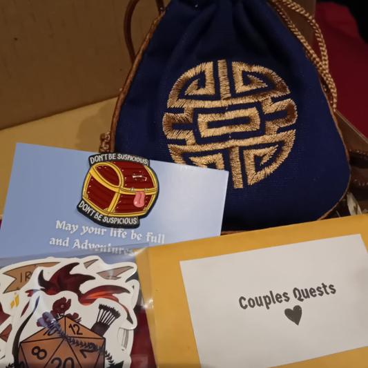 Collection of cards and a decorative bag with intricate patterns on a wooden surface.