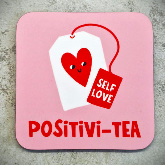 A pink coaster with a cute teabag design on it with the phrase self love attached to the teabag. underneath the teabag is the word Positivi-tea.