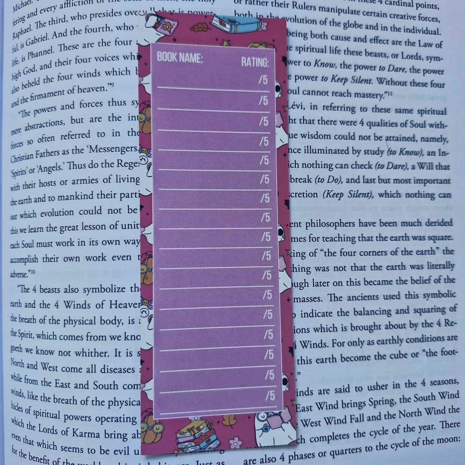 Purple ruler bookmark on a book with visible text