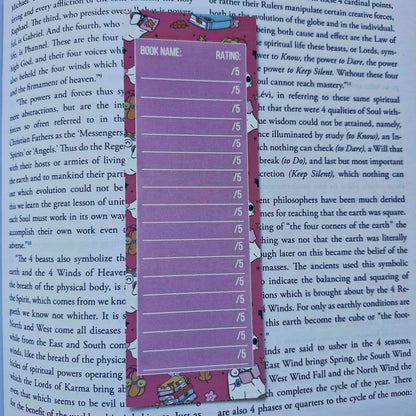 Purple ruler bookmark on a book with visible text