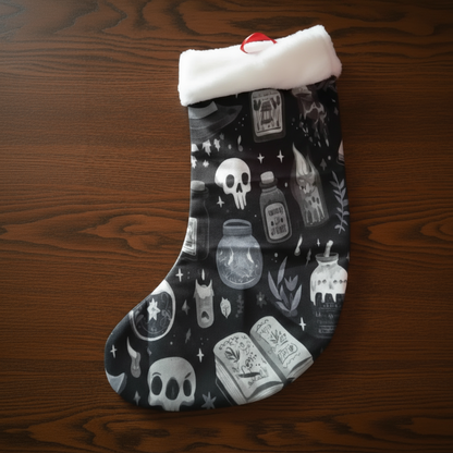 A black spooky Christmas Stocking with witchy imagery on it. 