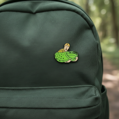 Enamel Pin of Steve Irwin Holding a Croc Shoe on a green backpack