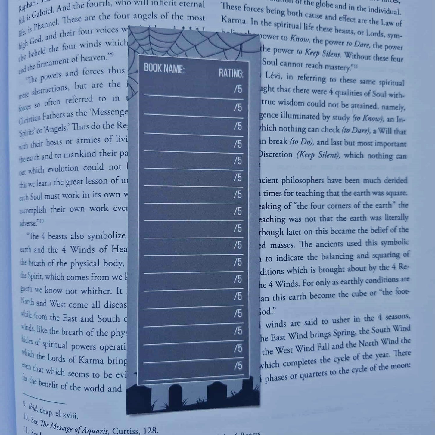 Blue bookmark with rating scale on a book page