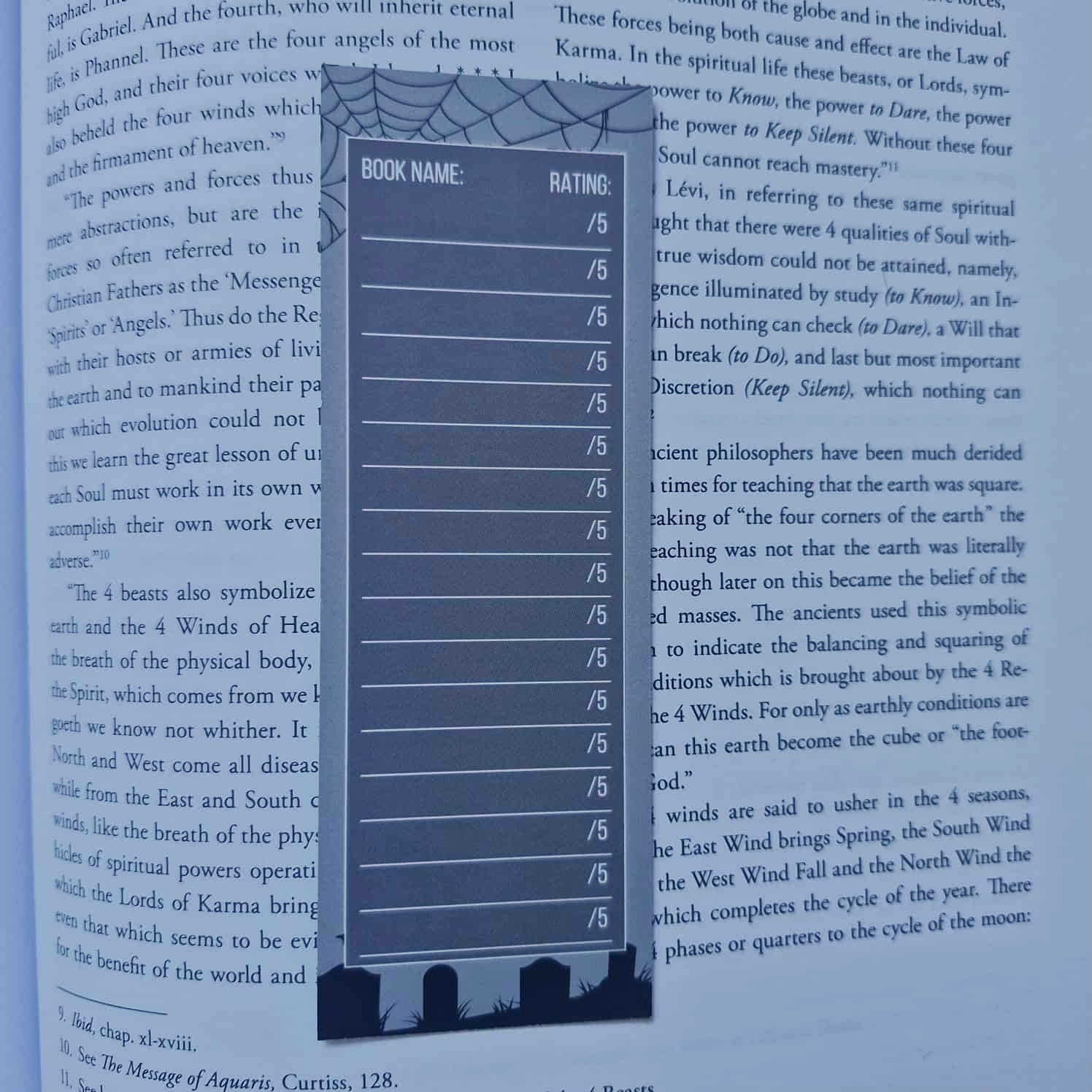 Blue bookmark with rating scale on a book page