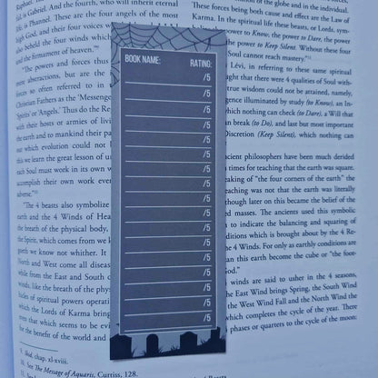 Blue bookmark with rating scale on a book page