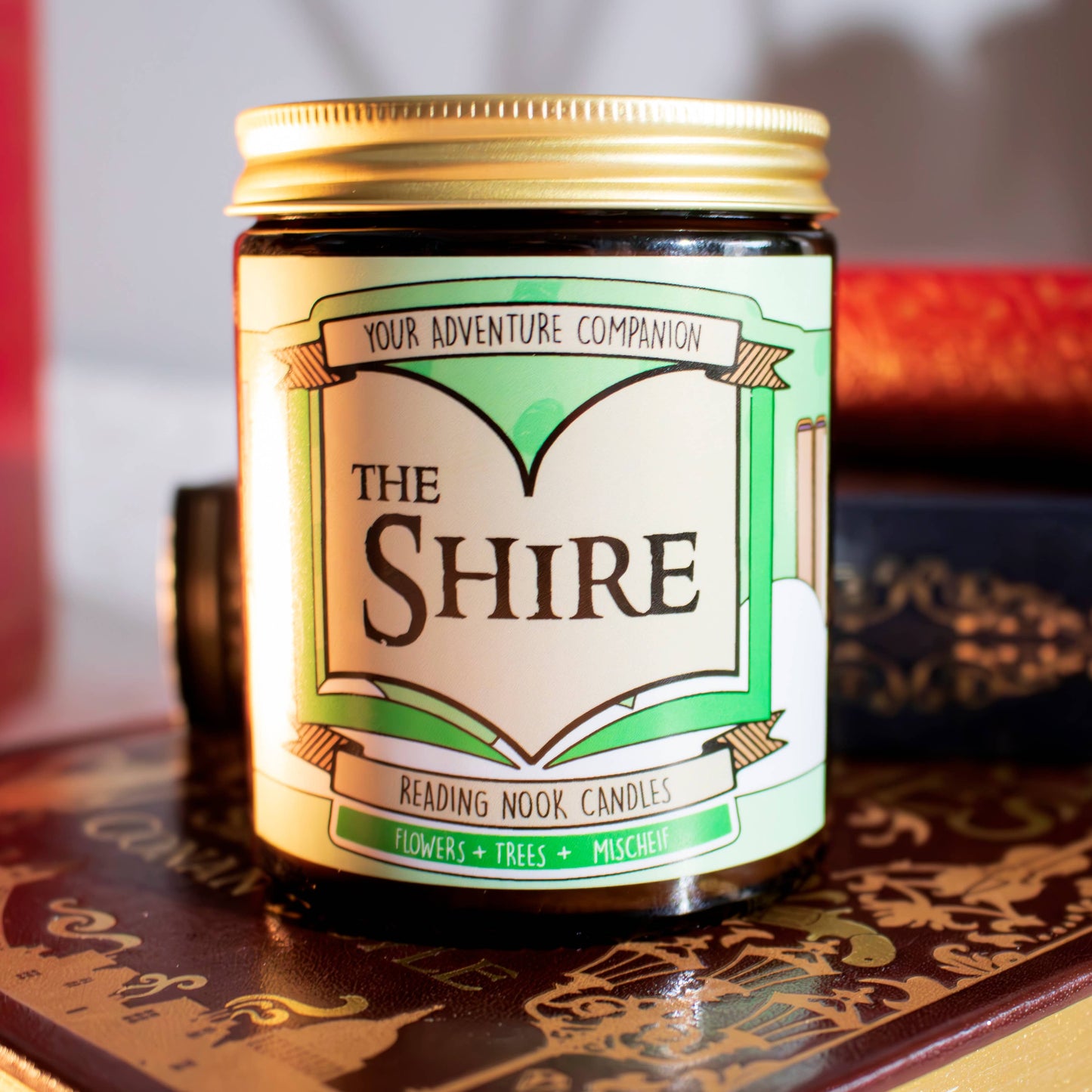 Candle jar labeled 'The Shire' on a decorative surface