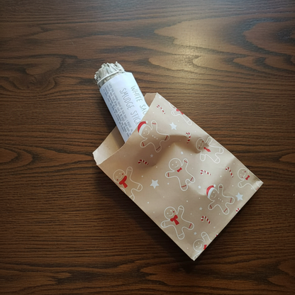 White sage smudge stick in a decorative paper cone which has come from a witchy advent calendar with a Halloween-themed background