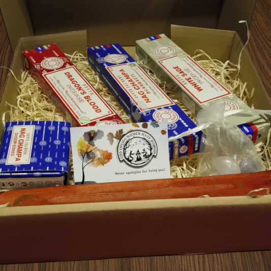 Box of incense sticks with visible branding on a dark background