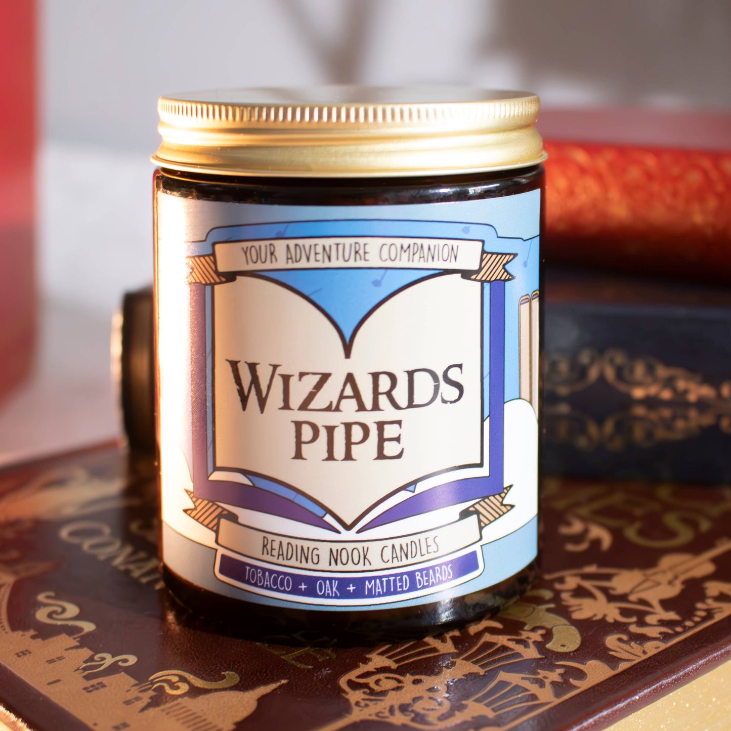 Candle jar labeled 'Wizards Pipe' on a decorative surface